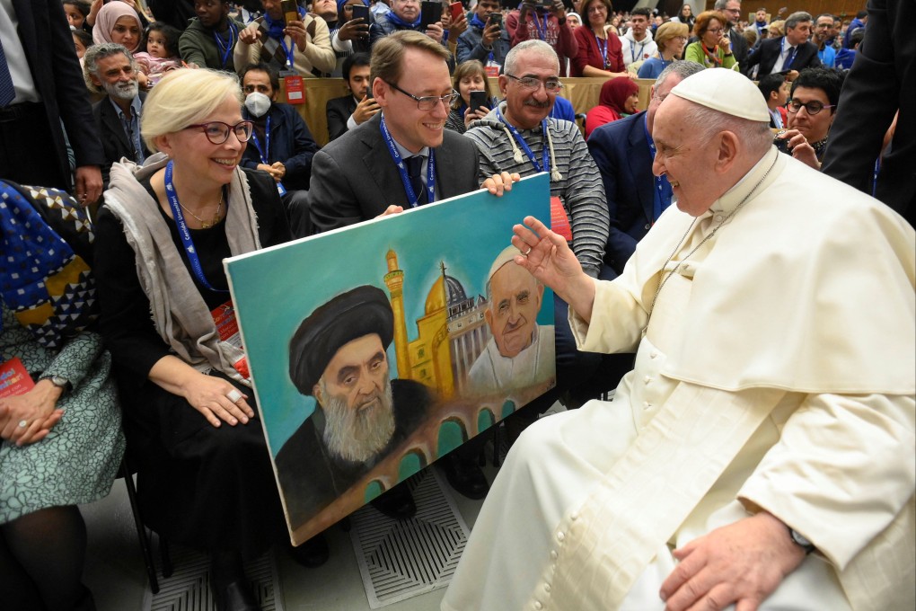 Pope Francis attends a meeting with refugee families at the Paul VI Hall at the Vatican on Saturday. Photo: Vatican Media / ­Handout via Reuters