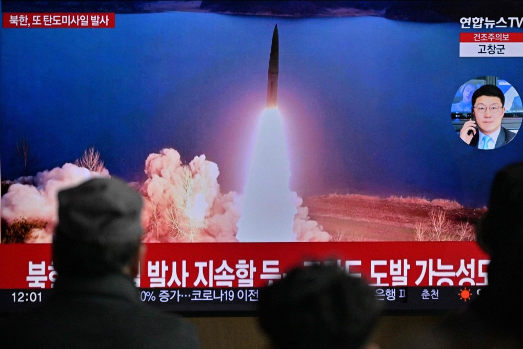 People in Seoul watch a railway station television on Sunday showing a news broadcast with file footage of a North Korean missile test. Photo: AFP