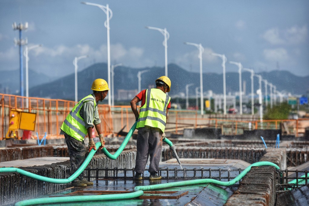 Workers at the construction site of Gaolan Harbour Interchange of Hezhou-Gaolan Port Highway project in south China’s Guangdong province on May 5. Chinese regulators have prioritised infrastructure assets in its fledgling Reit market. Photo: Xinhua