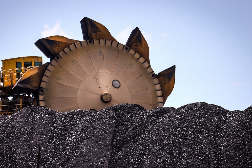 An excavator is seen on a pile of coal at the Port of Newcastle, Australia. Chinese imports of Australian coal resumed in February. Photo: Bloomberg