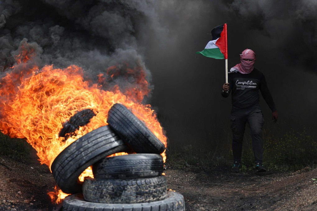 A Palestinian protester in Gaza City near the border with Israel on Sunday, in protest against a meeting in Egypt between Israeli and Palestinian representatives. Photo: AFP