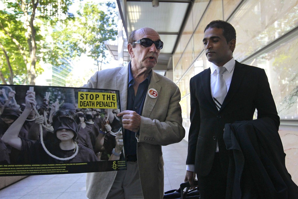Singapore lawyer M. Ravi (right) was also suspended for a year in 2007 for being disrespectful to a judge. File photo: AFP/Straits Times