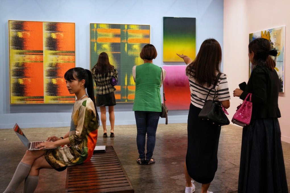 Visitors on the first day of Art Basel Hong Kong 2023 look at some of the contemporary art on display at the fair in the Hong Kong Convention and Exhibition Centre. Photo: Elson Li