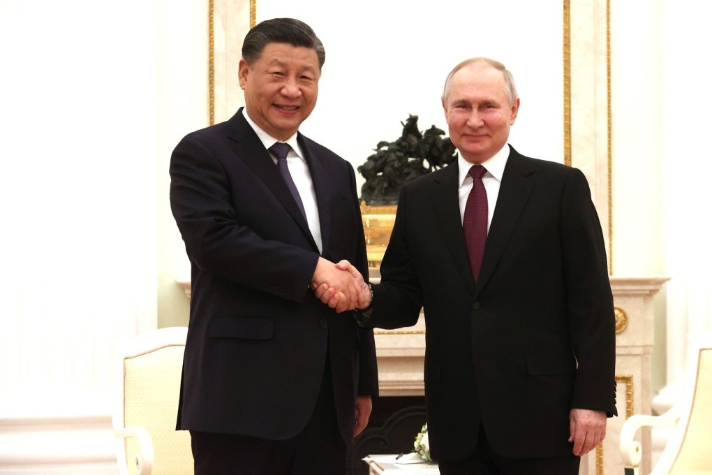 Russian President Vladimir Putin welcomes Chinese leader Xi Jinping before their meeting in Moscow on Monday. Photo: Kremlin via dpa