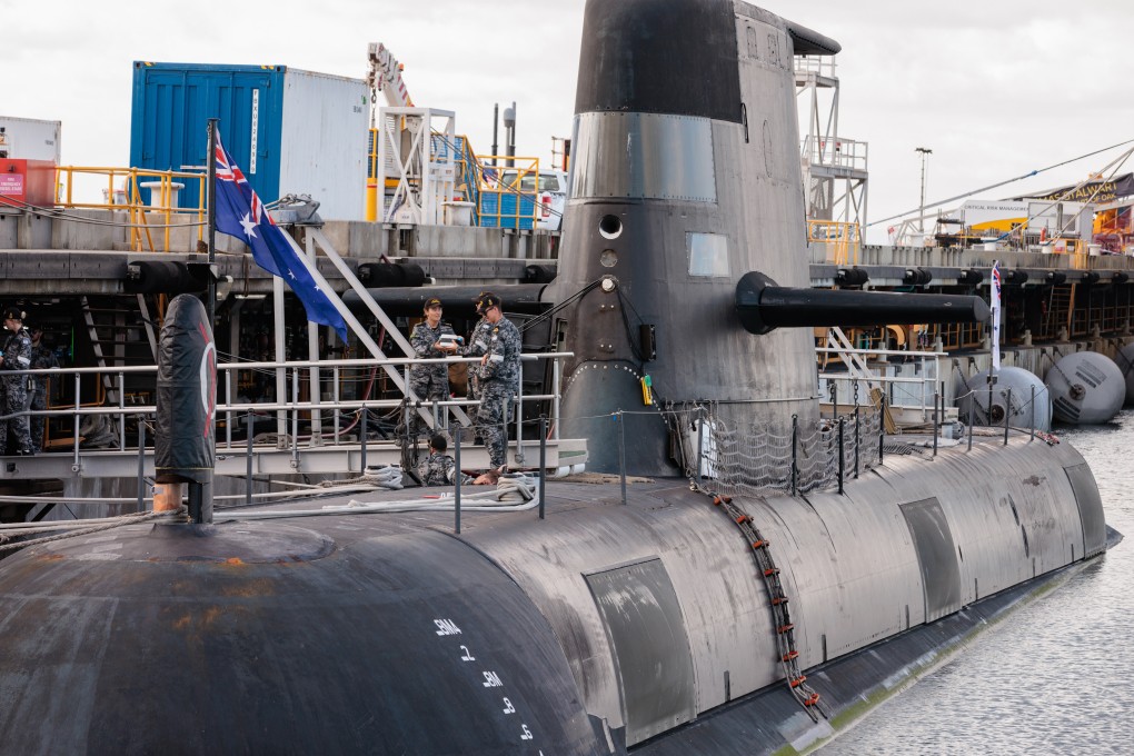 Crew members are seen working onboard HMAS Rankin, a Collins Class submarine at HMAS Stirling in Perth, during a visit by Australian Defence Minister. Photo: /dpa