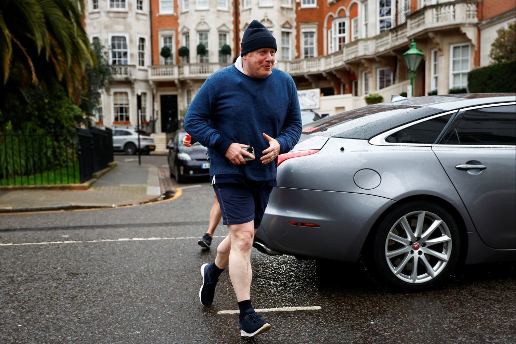 Former British prime minister Boris Johnson walks home after his morning run, in London, on March 21. Photo: Reuters