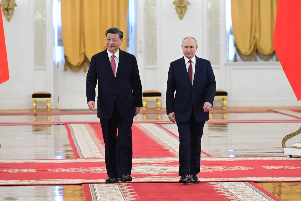 Russian President Vladimir Putin, right, and Chinese President Xi Jinping attend an official welcome ceremony at The Grand Kremlin Palace, in Moscow. Photo: AP