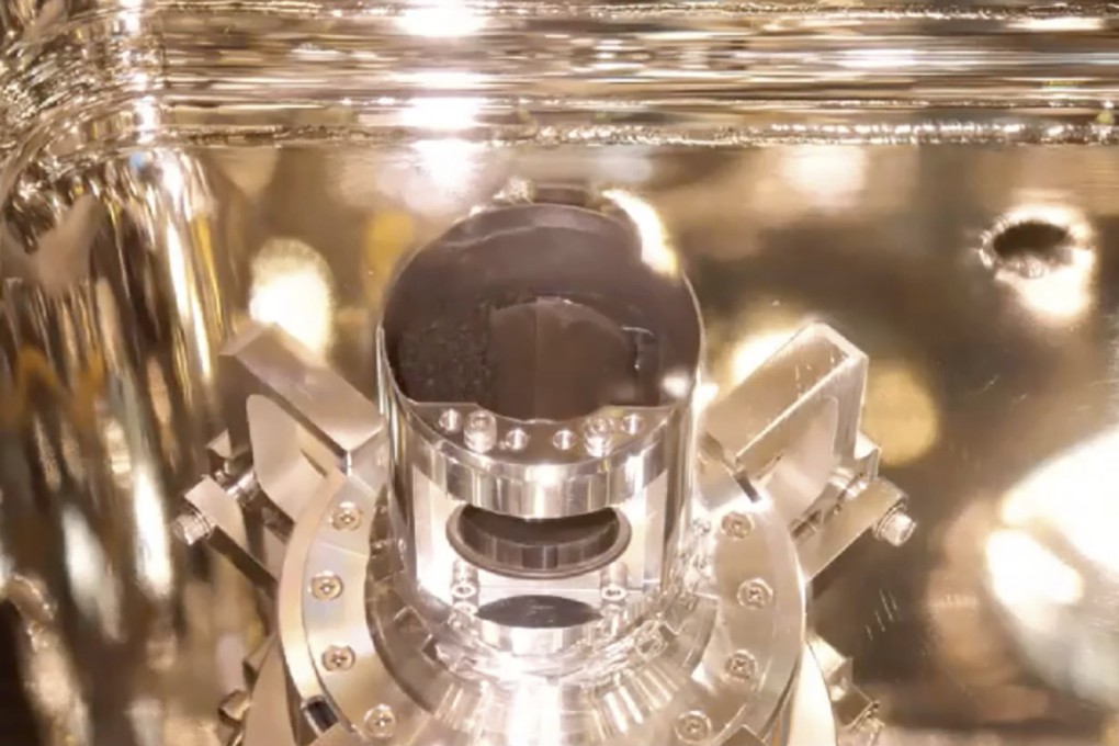 Samples from the asteroid Ryugu are seen inside a container of the Hayabusa2’s re-entry capsule after it returned to Earth in 2020. Photo: Japan Aerospace Exploration Agency via AP
