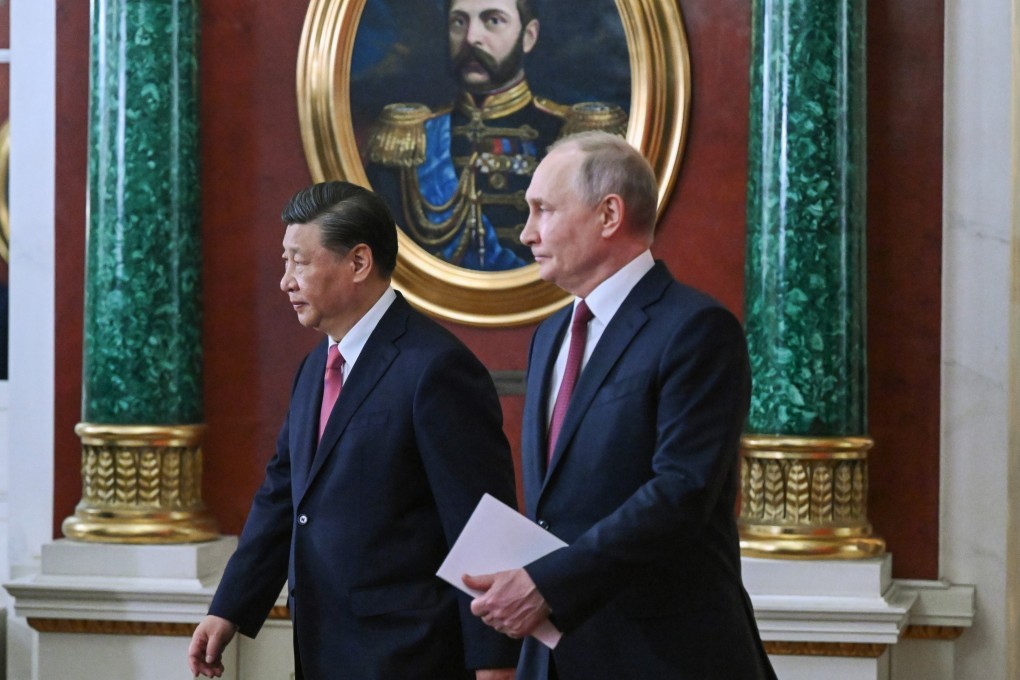 Chinese President Xi Jinping and Russian leader Vladimir Putin arrive to attend a signing ceremony in Moscow on Tuesday. Photo: Kremlin Pool Photo via AP