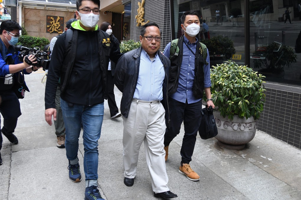 Former legislator Albert Ho being escorted by police from his home on Tuesday. Photo: Handout
