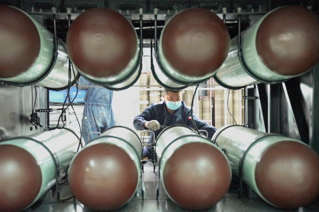 A staff member assembles a natural gas pipeline for a vehicle at the new energy factory of Zhengzhou Yutong Bus Co in central China’s Henan province on March 8. The economic releases capturing China activity in January and February showed a pickup in the manufacturing and services segments of the economy as well as an increase in retail sales. Photo: Xinhua