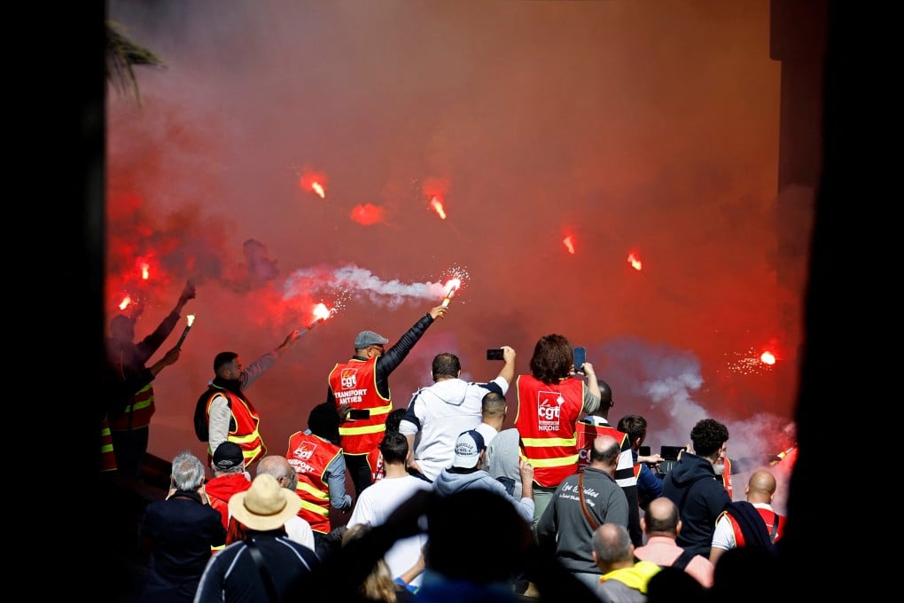 Demonstrators in CGT labour union vests on the ninth day of nationwide strikes and protests against French government’s pension reform. Photo: Reuters