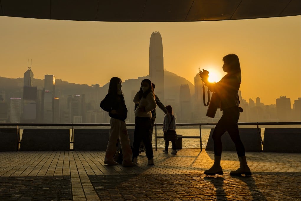 People visiting the Tsim Sha Tsui waterfront at sunset in December. Photo: Jelly Tse