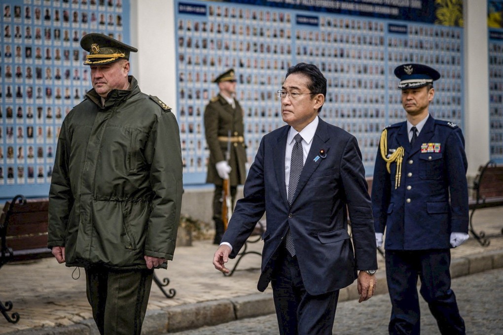 Japanese Prime Minister Fumio Kishida visits the Wall of Remembrance in Kyiv to pay tribute to Ukrainian soldiers killed during the Russian invasion. Photo: Handout via Reuters