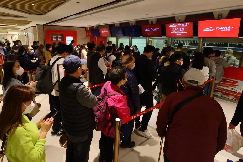 Travellers queue up for tickets at the Macau Ferry Terminal at Shun Tak Centre, on January 13, 2023. Shun Tak Holdings expects tourism activity to pick up this year. Photo: Dickson Lee