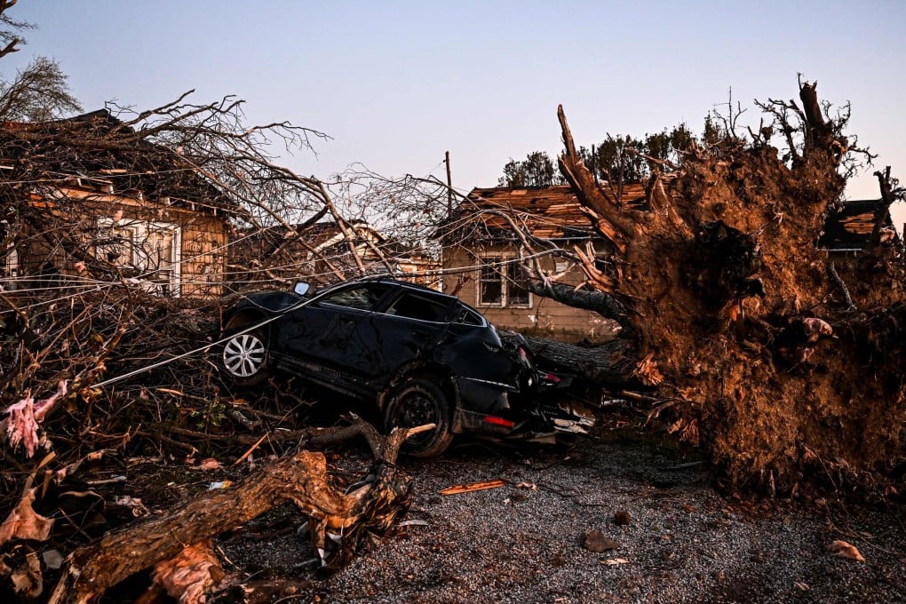 The remains of a house and cars are entangled in tree limbs in the US state of Mississippi, after a tornado touched down in the area. Photo: AFP