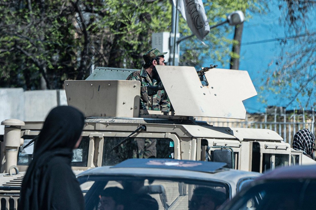 A Taliban security personnel sits on a humvee armoured vehicle near the site of a suicide attack in Kabul on March 27, 2023. Photo: AFP