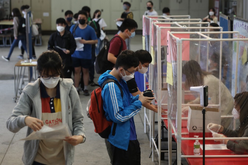 Students have their identity check for the Diploma of Secondary Education (HKDSE) English examination at Tsuen Wan Wong Siu Ching Secondary School. Photo: SCMP / Xiaomei Chen