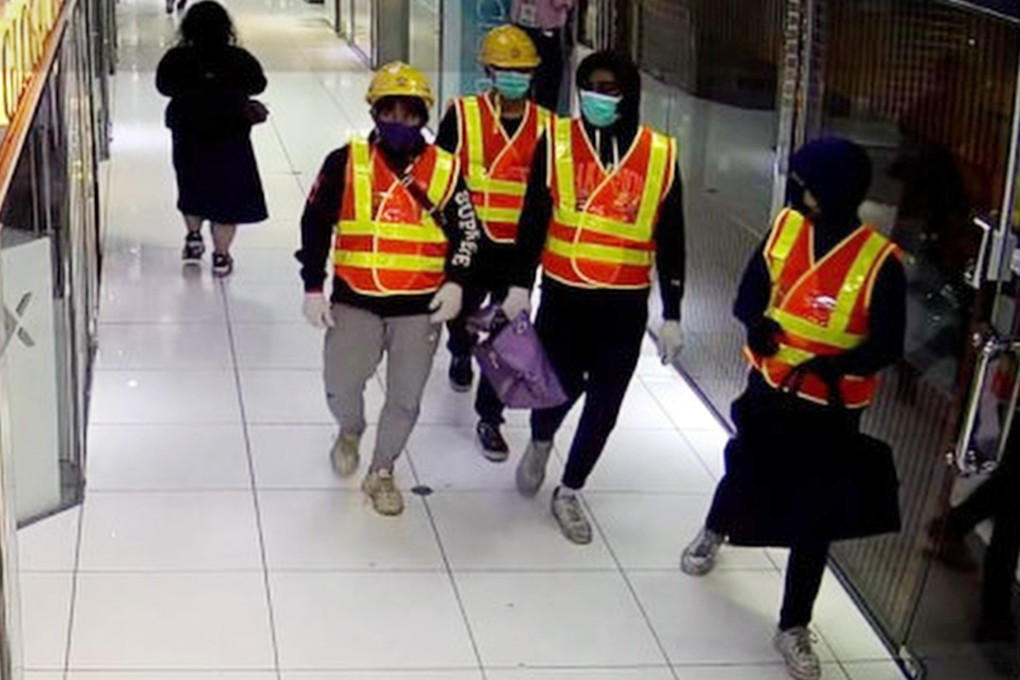 The four men dressed as construction workers who stole HK$10 million worth of luxury watches in a raid on a store in Tsim Sha Tsui. Photo: Handout