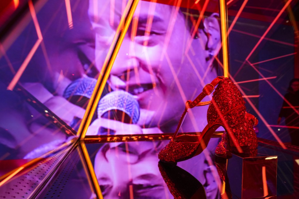 The eye-catching pair of red high heels are on loan from Cheung’s partner for the exhibition. Photo: Sam Tsang