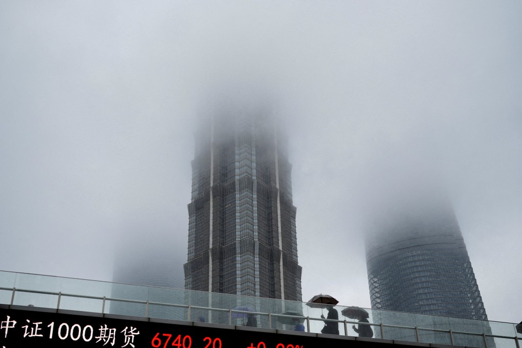 An electronic board shows stock indices in Shanghai’s financial district. The UBS comments might offer some respite to Chinese stocks, which have seen momentum wane amid doubts about the durability of China’s economic recovery. Photo: Reuters
