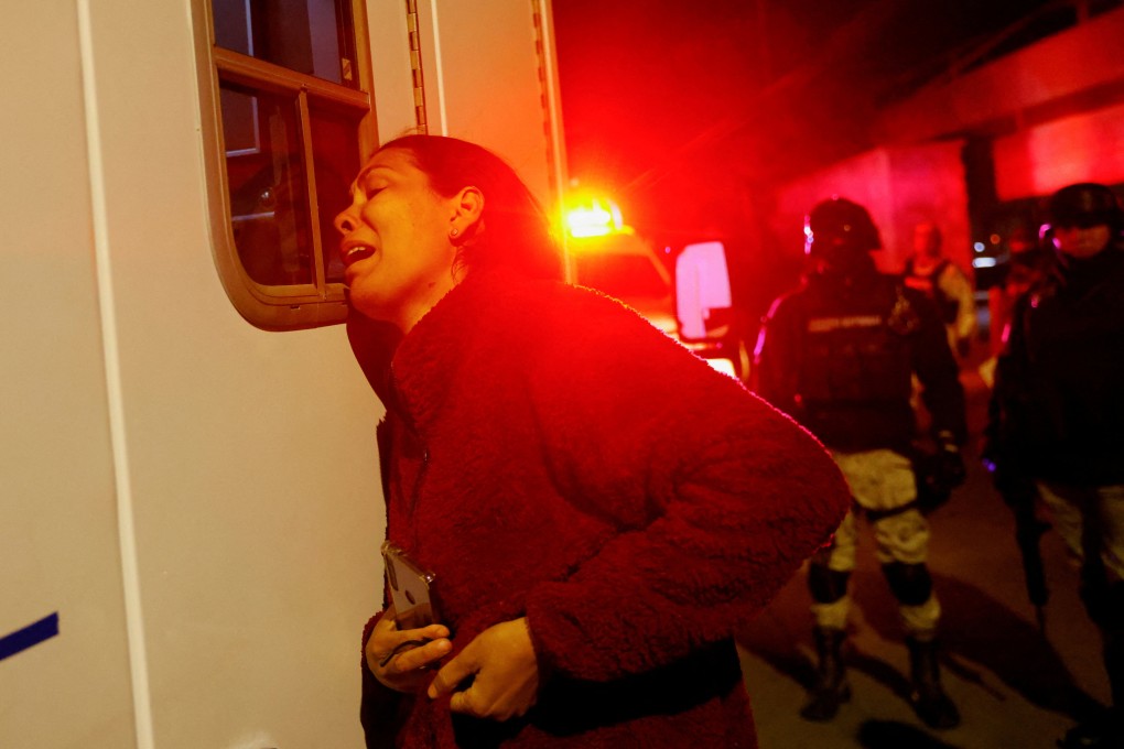 A Venezuelan migrant reacts after her husband was injured during a fire in Ciudad Juarez, Mexico, on Monday. Photo: Reuters