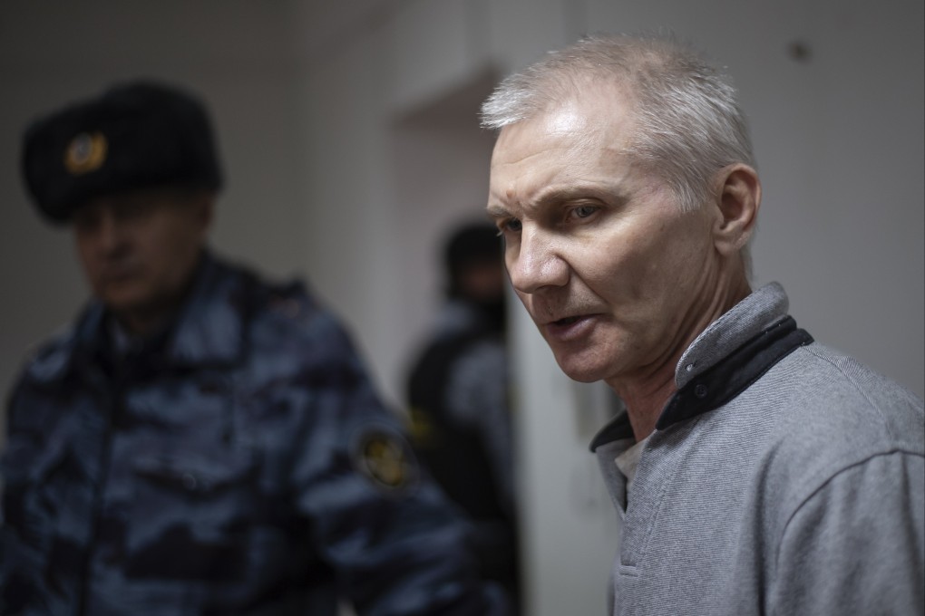 Alexei Moskalyo is escorted from a courtroom in Yefremov, some 300km from Moscow, on Monday. Photo: AP