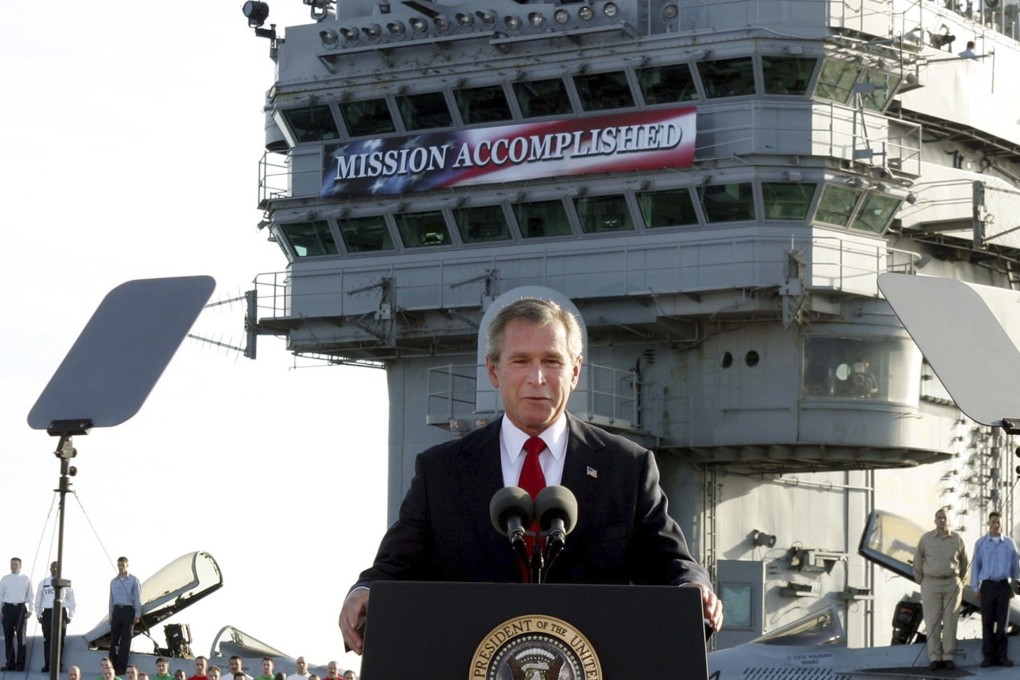 US President George W. Bush declares the major fighting over in Iraq as he speaks aboard the USS Abraham Lincoln off the California coast in May 2003. Photo: AP
