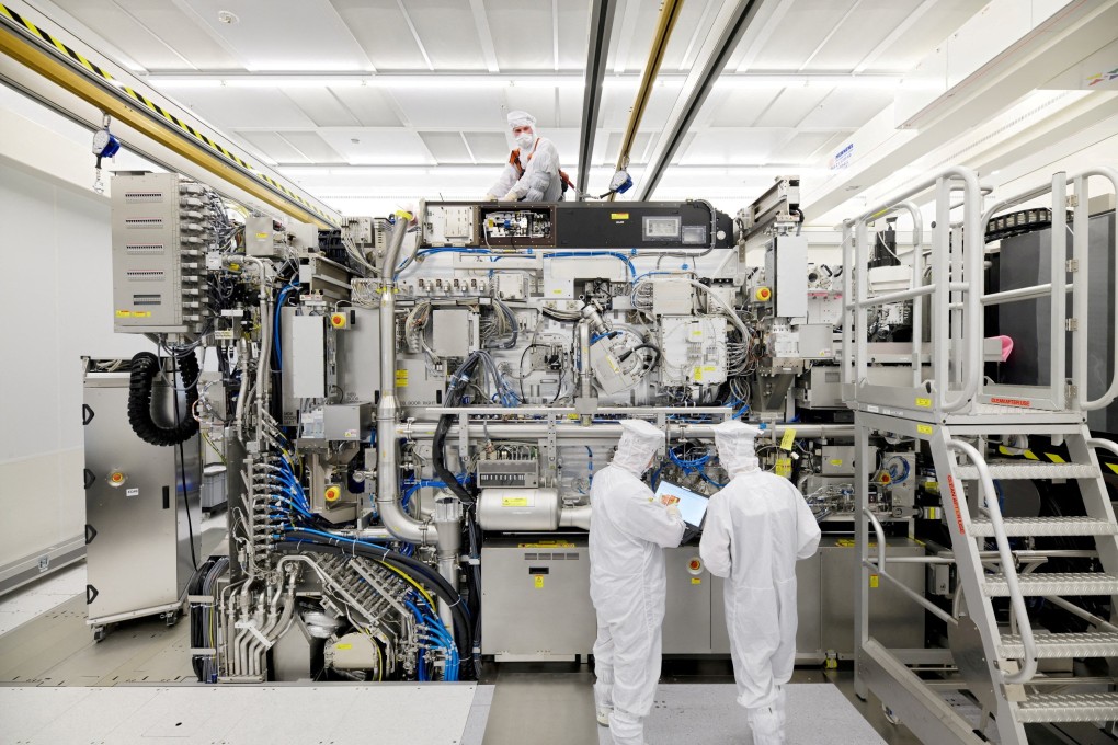 ASML employees working on assembly of lithography tool. Photo: Reuters