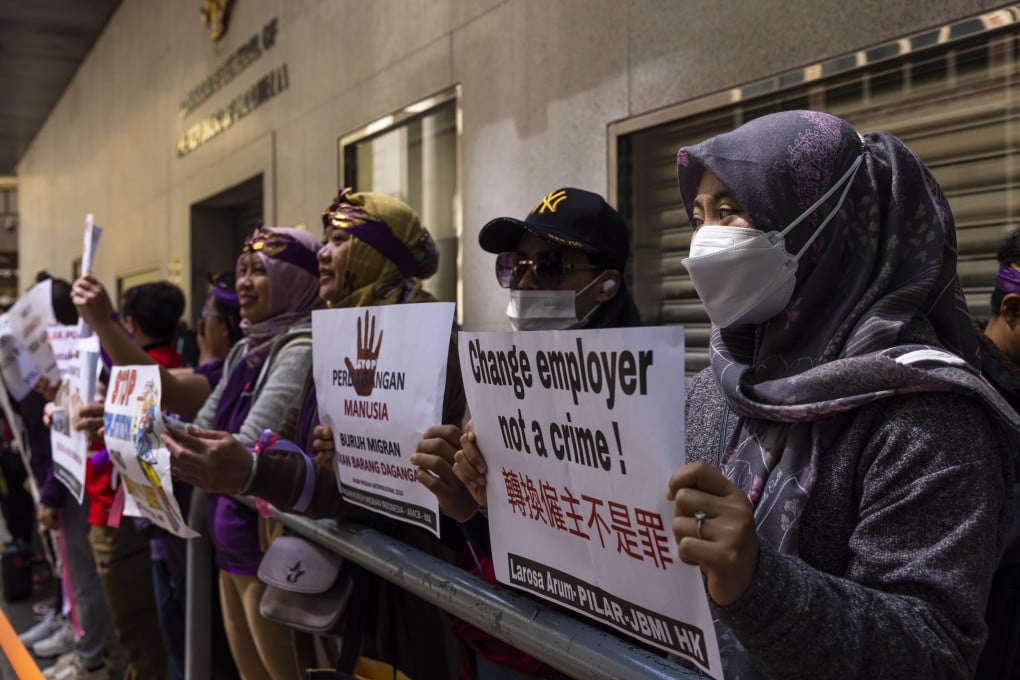 Domestic workers gather outside the Indonesian consulate in Hong Kong on March 5, carrying placards in favour of migrant workers’ rights. Photo: AP