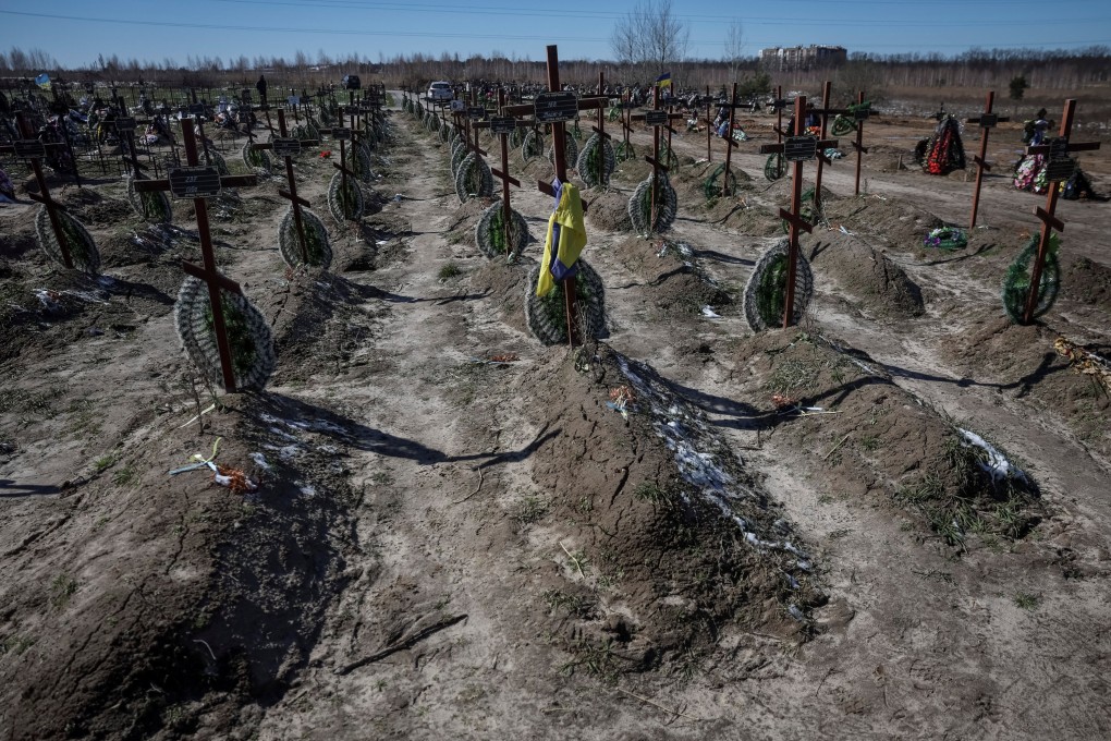 Graves of unidentified people killed by Russian soldiers during the occupation of Bucha. Photo: Reuters