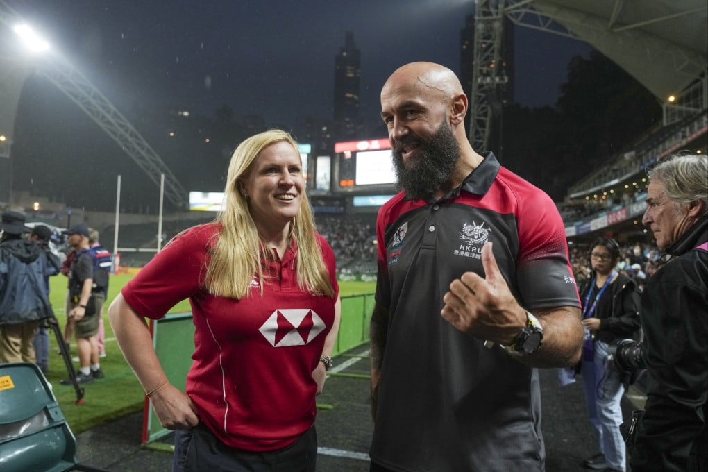 Former England international Nolli Waterman (left) and former New Zealand star DJ Forbes share a moment at the Cathay/HSBC Hong Kong Sevens. Photo: Sam Tsang