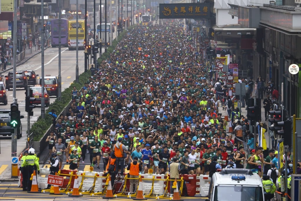 Competitors run through Mong Kok during the Standard Chartered Hong Kong Marathon in February. Photo: Dickson Lee