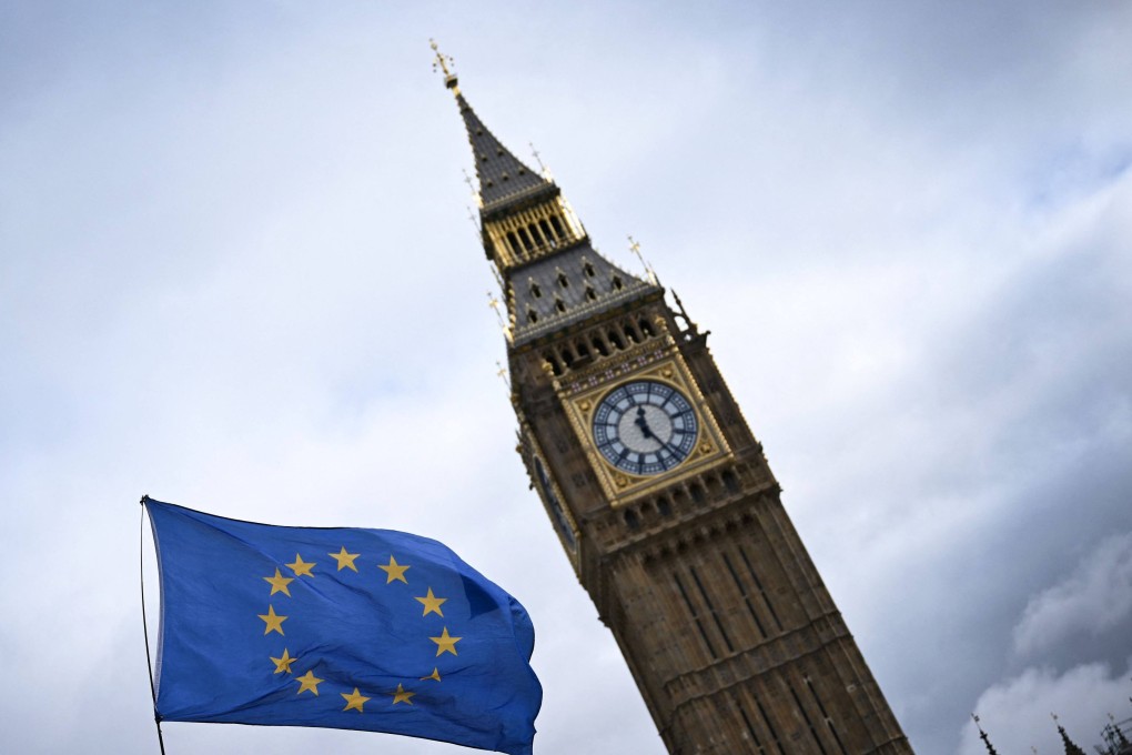 A European Union flag, flown by anti-Brexit activists, flaps in wind, in front of the Elizabeth Tower, commonly known as Big Ben, in central London on March 1. Britain agreed on Friday to join the Comprehensive and Progressive Agreement for Trans-Pacific Partnership, its biggest trade deal since leaving the European Union three years ago. Photo: AFP
