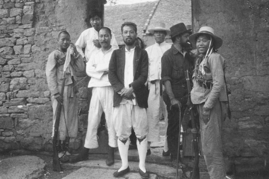 Bandits and captives at the Temple of the Clouds at the base of Paotzuku mountain, including Lee Solomon (second right, with cigarette) and former Cambridge student and banker Chi Cheng (centre), following the hijacking of China’s Peking Express. Photo: The State Historical Society of Missouri