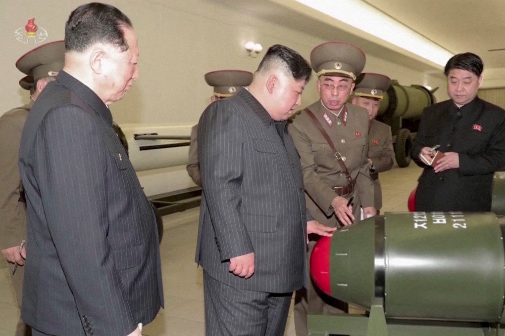 North Korean leader Kim Jong-un inspects nuclear warheads at an undisclosed location in this undated still image used in a video. Photo: KRT/via Reuters TV