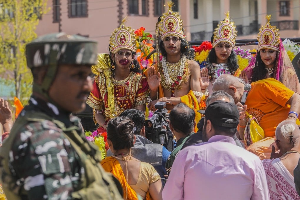 An Indian paramilitary soldier stands guard as Kashmiri Hindus take part in a procession to mark Ram Navami festival. Photo: AP