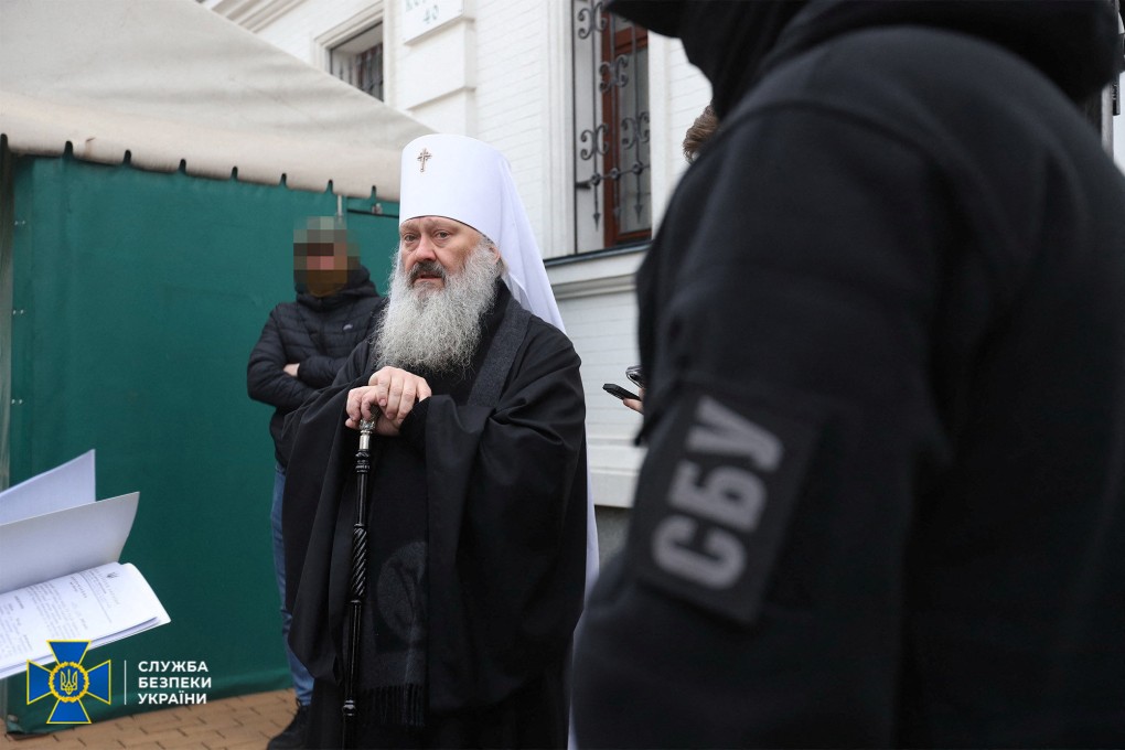 Members of the State Security Service of Ukraine read an accusation letter to Metropolitan Pavel, the abbot of the Kyiv-Pechersk Lavra monastery, in Kyiv, Ukraine on Saturday. Photo: Press Service of the State Security Service of Ukraine / Handout via Reuters