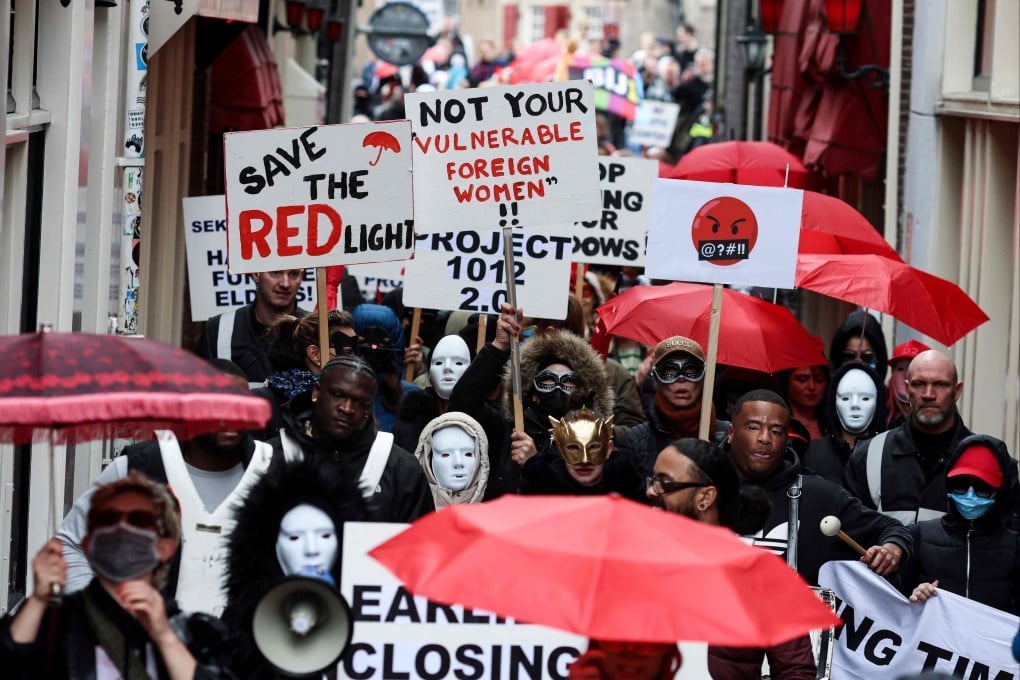 Sex workers and sympathisers take part in a demonstration in Amsterdam on Thursday to protest against plans to move the city’s historic red light district to a new erotic centre. Photo: AFP