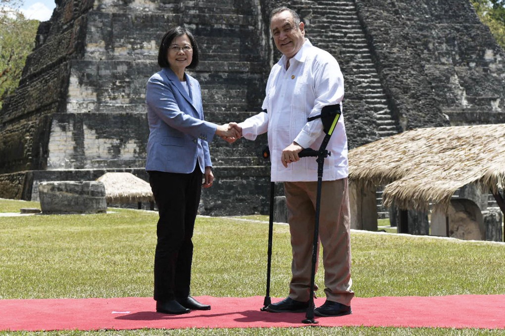 Taiwan’s President Tsai Ing-wen, left, and Guatemala’s President Alejandro Giammattei shake hands at the Tikal archaeological site in Peten, Guatemala on Saturday. Photo: Handout / Guatemalan Presidency / AFP