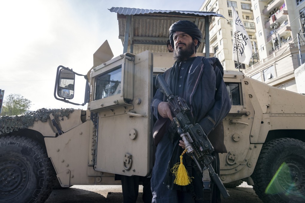 A Taliban fighter stands guard near the Foreign Ministry in Kabul, Afghanistan on Monday. Three British men have been detained by the Taliban in Afghanistan, it was reported on Saturday. Photo: AP