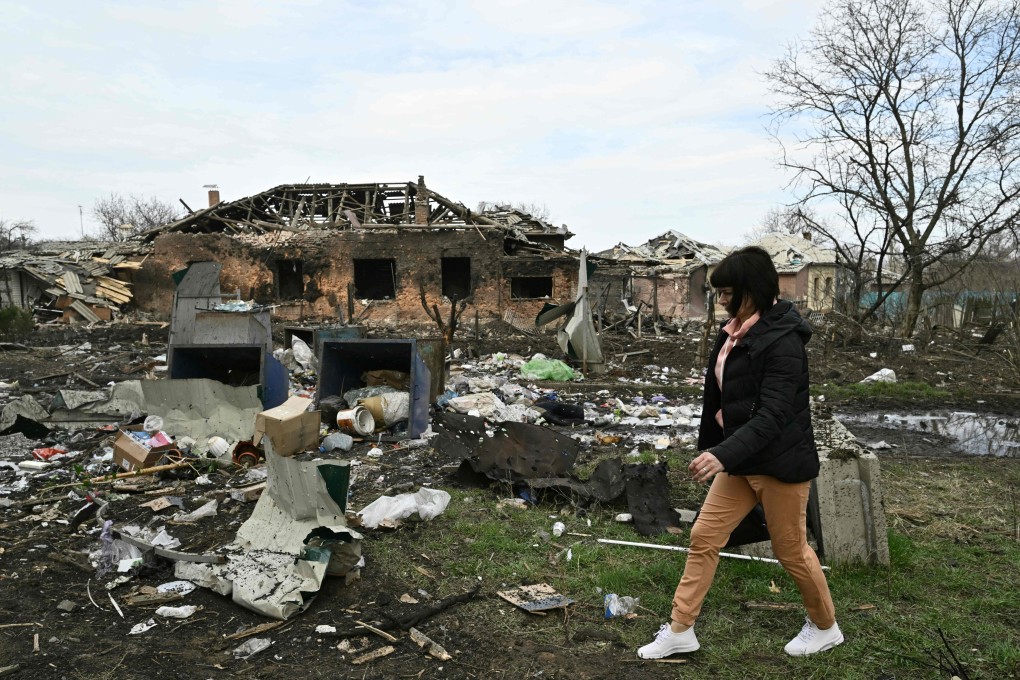 A resident walks by a damaged house after a Russian missile strike in the town of Kostyantynivka, Donetsk region, Ukraine on Sunday. Photo: AFP