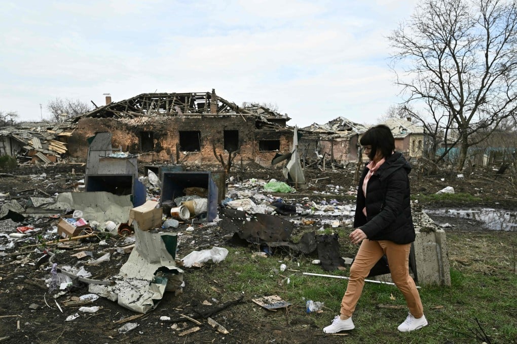 A resident walks by a damaged house after a Russian missile strike in the town of Kostyantynivka, Donetsk region, Ukraine on Sunday. Photo: AFP