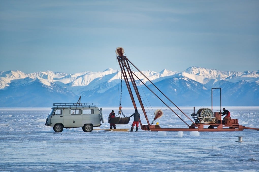 Strings of detectors are lowered into Russia’s Lake Baikal, the world’s deepest lake, as part of a underwater neutrino telescope. Photo: Baikal-GVD, via Science