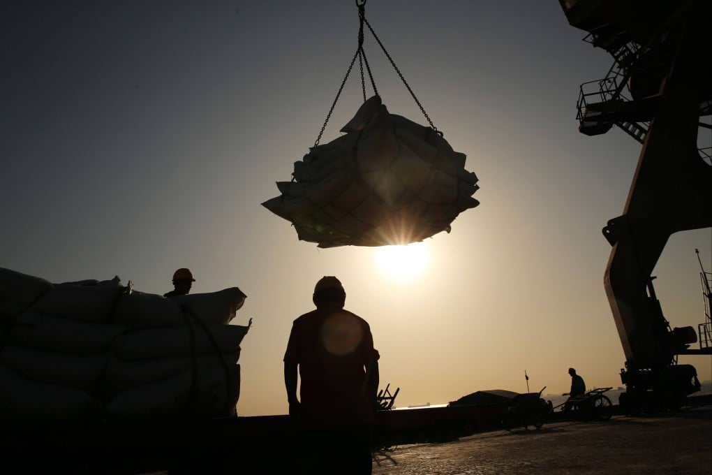 Workers transfer soybeans – one of Brazil’s major exports to China – at a port in Jiangsu province. Photo: AFP