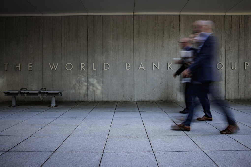 People walk past the World Bank Group headquarters in Washington on September 27, 2022. MDBs, such as the World Bank, have maintained AAA credit ratings since their inception. Photo: Bloomberg