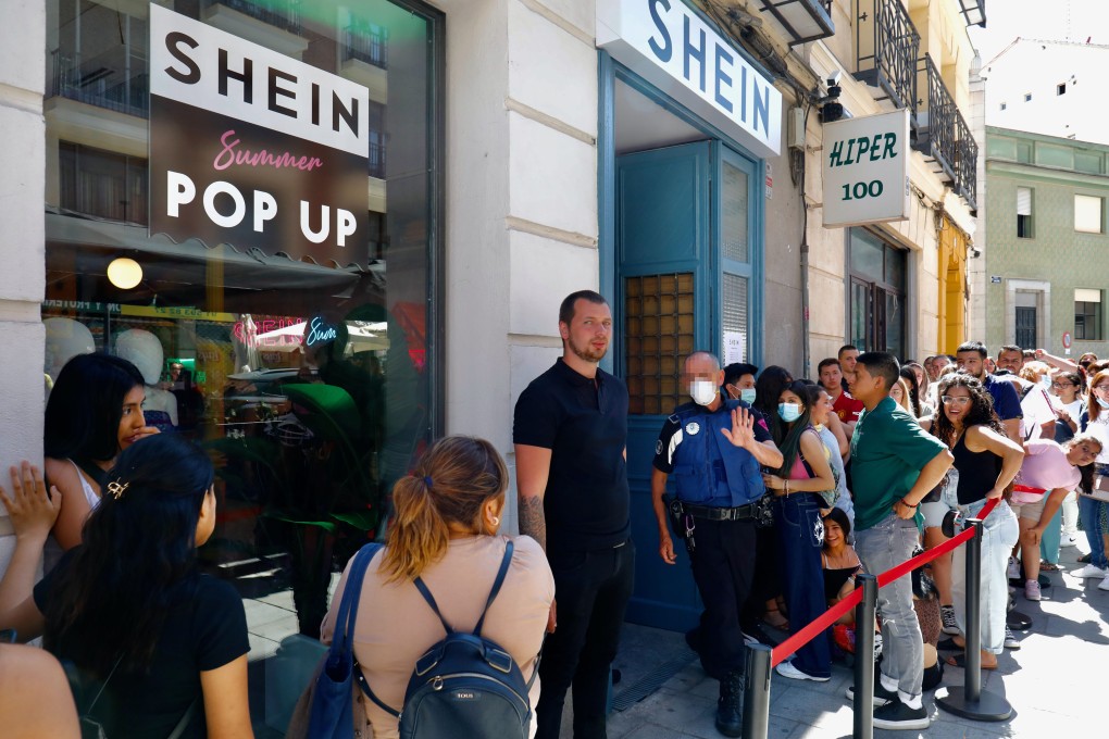 Customers outside the first physical Shein store in Madrid, Spain, June 2, 2022. Photo: Getty Images
