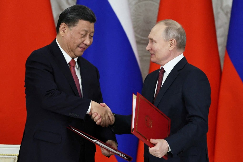 Chinese President Xi Jinping shakes hands with Russian President Vladimir Putin following their talks at the Kremlin in Moscow, last month. Photo: Sputnik via Reuters
