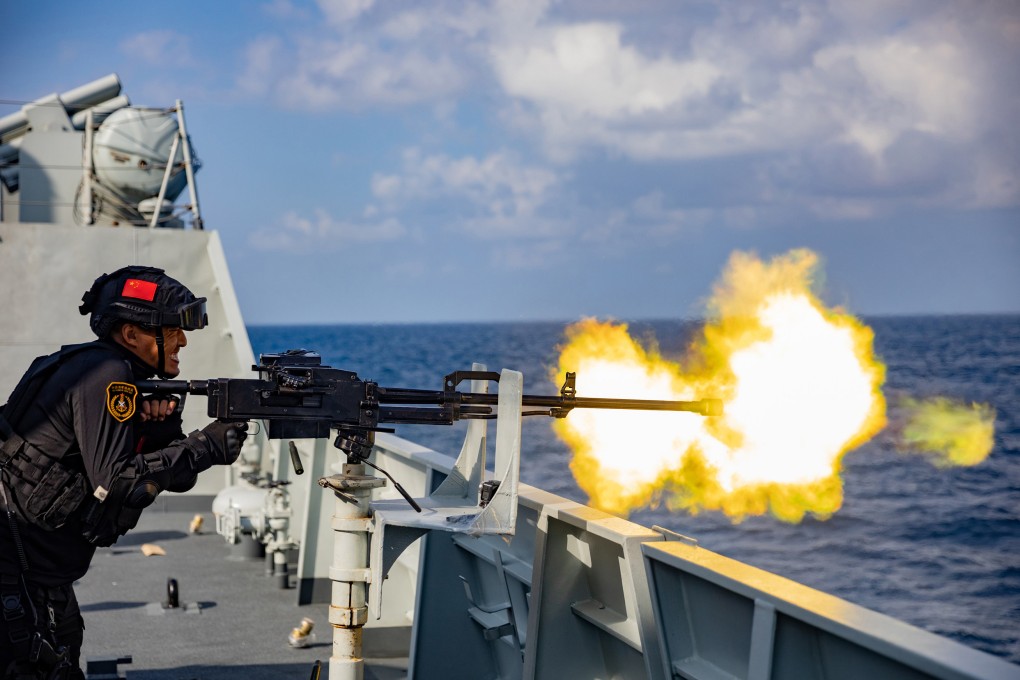 A Chinese serviceman fires a ship-mounted weapon during a combat training exercise in January. Photo: Xinhua