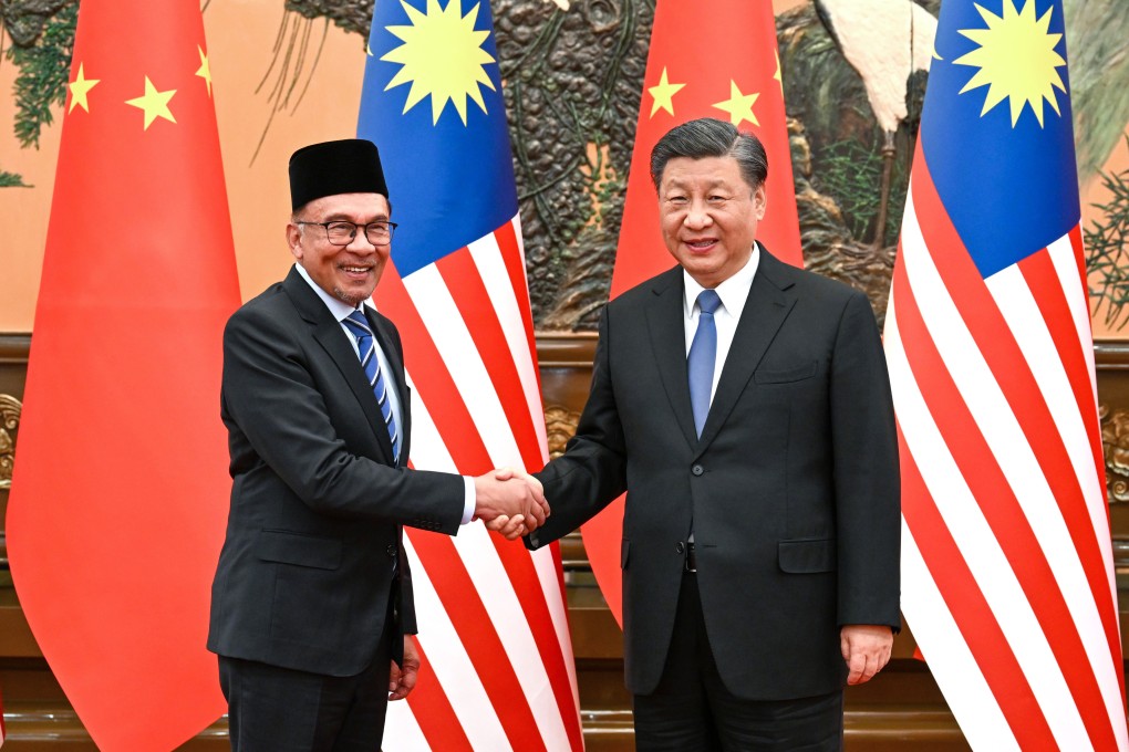 Malaysia’s Prime Minister Anwar Ibrahim with Chinese President Xi Jinping at the Great Hall of the People in Beijing on March 31. Photo: Xinhua